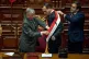 Peru's former president of the Congress Jose Jeri (centre) receives the presidential sash from congressman Fernando Rospigliosi (left) as he is sworn-in as the interim president in Lima, Peru, October 10, 2025