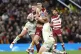 Raring: Wigan Warriors’ Morgan Smithies is brought down by the Catalans Dragons, October 2023