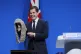 Shadow justice secretary Robert Jenrick removes a judge's wig from a black box as he delivers a speech during the Conservative Party Conference at the Manchester Central Convention Complex, October 7, 2025