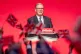 People wave flags as Prime Minister Keir Starmer delivers his keynote speech during the Labour Party Conference at the ACC Liverpool, September 30, 2025