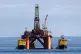 The oil platform Stena Spey is moved with tugboats amongst other rigs that have been left in the Cromarty Firth near Invergordon in the Highlands of Scotland