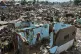 A resident returns to what remains of their home after Typhoon Kalmaegi devastated communities along the Mananga River in Talisay City, Cebu province, central Philippines, November 5, 2025