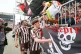 St. Pauli players Philipp Treu, right, and Manolis Saliakas high-five with the fans after a Bundesliga soccer match between FC St. Pauli and VfL Bochum, May 17, 2025, in Hamburg, Germany