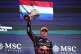 Red Bull driver Max Verstappen of the Netherlands celebrates on the podium his third place during the Brazilian Formula One Grand Prix at the Interlagos race track, in Sao Paulo, November 9, 2025
