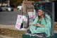Shana Blake sits in a cage dressed as the Statue of Liberty to protest federal law enforcement presence in Charlotte, N.C., November 17, 2025