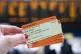 A general view of a person holding train tickets at Waterloo train station in London