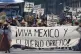 CONTRAST: People dressed as revolutionary fighters carry a banner that reads in Spanish ‘Long live Mexico and the working class!’ during a parade marking the 115th anniversary of the Mexican Revolution in the Zocalo, Mexico City’s main square, November 20