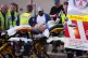 Emergency workers transport a person on a stretcher after a reported shooting at Bondi Beach in Sydney, December 14, 2025