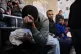 Mohammed al-Neder, 21, mourns over the body of his 4-month-old brother Ahmed, who was killed by Israeli fire, during his funeral at Shifa Hospital in Gaza City, Saturday, Dec. 20, 2025.