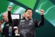 Paul Lim celebrates winning their match against Jeffrey de Graaf on day three of the Paddy Power World Darts Championship at the Alexandra Palace, London, December 13, 2025