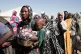 Women displaced from El-Fasher stand in line to receive food aid at the newly established El-Afadh camp in Al Dabbah, in Sudan's Northern State, November 16, 2025