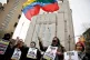 OUTRAGE: Protesters hold signs calling for the release of Venezuelan President Nicolas Maduro outside Manhattan Federal Court before his arraignment in New York, on Monday January 5