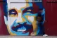 A pedestrian walks past a mural of Venezuelan President Nicolas Maduro Sunday, Jan. 4, 2026
