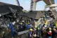 Rescuers work amid the wreckage after a construction crane fell into a passenger train in Nakhon Ratchasima province, Thailand, January 14, 2026