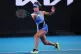 Emma Raducanu of Britain plays a forehand return to Mananchaya Sawangkaew of Thailand during their first round match at the Australian Open tennis championship in Melbourne, Australia, January 18, 2026
