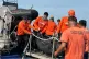Philippine coast guard personnel carry a body bag in Zamboanga city, January 26, 2026, after M/V Trisha Kerstin 3, an inter-island cargo and passenger ferry sank