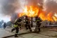 Firefighters battle a blaze at a house as wildfires burn in Lirquen, Chile, January 18, 2026