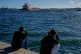 People watch the oil tanker Ocean Mariner, Monrovia, arrive to the bay in Havana, Cuba, January 9, 2026