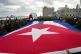 People carry a Cuban flag during a government-organised rally protesting the killing of Cuban officers in Venezuela while US forces kidnapped Venezuelan President Nicolas Maduro and his wife, in Havana, Cuba, January 16, 2026