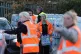Workers hand out bottled water at the Tunbridge Wells Sports Centre after people in the area experienced a loss of water or low pressure since Saturday evening, December 3, 2025