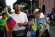 A supporter holds a poster of Venezuelan President Nicolás Maduro in Caracas, Venezuela, January 3, 2026, after U.S. President Donald Trump announced that Maduro had been captured and flown out of the country