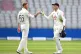England's Ben Stokes (left) and Jos Buttler at the end of play during day three of the First Test match at the Emirates Old Trafford, Manchester