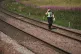 A police officer walks along the tracks at Carmont crossing, south of the scene in Stonehaven, Aberdeenshire, where a ScotRail train derailed at about 9.40am in the morning, August 12, 2020
