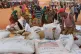 Workers distribute food aid from the World Food Program at a refugee camp in Dolo, Somalia on July 18, 2012