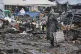People walk at a ruined city market following a Russia's attack in Odesa, Ukraine, February 12, 2026