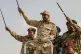 Gen. Mohammed Hamdan Dagalo, center, greets the crowd during a military-backed tribes' rally in the Nile River State of Sudan