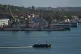 A ferry boat navigates across Havana Bay as it passes Cuban coast guard ships docked at the port as it leaves Casablanca, Cuba, February 26, 2026
