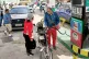 DAILY MISERY: A driver refuels a motorcycle as other drivers wait in a long line at a gas station in Havana, Cuba, Friday, January 30 2026