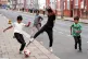 Children playing football on the street in Luton, August 1, 2025