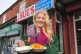 Newly-elected Green MP for Gorton and Denton, Hannah Spencer, eats chips in curry sauce from a takeaway near her constituency office in Manchester, February 27, 2026