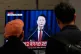 People watch a TV screen showing South Korean President Yoon Suk Yeol's televised briefing at a bus terminal in Seoul, South Korea, December 3, 2024