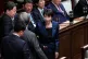 Japan's Prime Minister Sanae Takaichi (centre) talks with the ruling party's lawmakers during a special session of the lower house in Tokyo, Japan, February 18, 2026