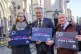 Vincent Kearney, Laura Davison and Séamus Dooley holding 'Journalism Is Not A Crime' signs outside the Royal Courts of Justice. Photo: Jess Hurd