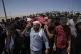 Mourners carry the body of Palestinian activist Awdah Hathaleen during his funeral in the West Bank Bedouin village of Umm al-Khair, August 7, 2025