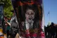 A protester holds a banner depicting Argentine President Javier Milei during a protest against a labor reform bill proposed by Milei's government in Buenos Aires, Argentina, February 27, 2026