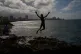 A youth jumps into the sea during a blackout in Havana, March 4, 2026