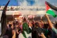 People welcome activists who took part in the Global Sumud Flotilla that attempted to sail to Gaza after they were released from Israeli prison, at Tunis–Carthage International Airport, October 5, 2025, in Tunis, Tunisia