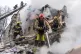 Firefighters put out the fire in the ruins of an apartment building following Russia's missile attack in Kharkiv, Ukraine, March 7, 2026
