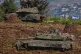 Israeli soldiers atop tanks at a staging area in northern Israel near the border with Lebanon, Israel, March 8, 2026
