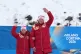 Anastasiia Bagiian, of Russia, and her guide Sergei Siniakin, wave from the podium after winning the gold medal in the cross country skiing women's 10Km interval start classic vision impaired final at the 2026 Winter Paralympics, in Tesero, Italy, March 1