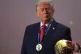 President Donald Trump stands on stage next to the FIFA World Cup after receiving the FIFA Peace Prize during the draw for the 2026 soccer World Cup at the Kennedy Centre in Washington, December 5, 2025