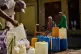 A man fills containers with water during a blackout in Havana, March 22, 2026