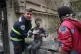 A first responder assists an injured boy following a strike that hit a residential building amid the U.S.-Israeli military campaign in Tehran, Iran, March 28, 2026