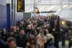 Commuters walk along a platform at Waterloo train station in London