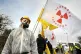 A protester outside the gate to Hinkley Point nuclear power station in Somerset where around 800 people gathered to on the eve of the first anniversary of the Fukushima disaster to demonstrate against the use of nuclear power