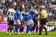 Newcastle United and Sunderland players clash as referee Anthony Taylor attempts to intervene during the Premier League match at St James' Park, Newcastle upon Tyne, March 22, 2026